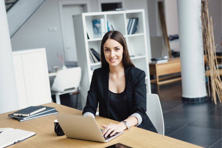 Personal Assistant Vs. Virtual Assistant Working On Laptop