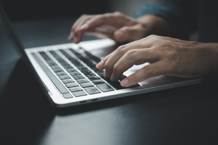 VA Working On Laptop Busy With Media Campaigns