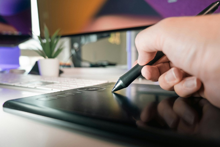 Virtual Graphic Designer Adam Working