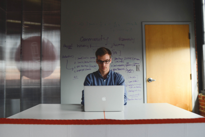 Link Outreach Specialist At His Desk