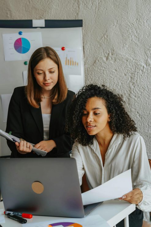 SEO virtual assistant discussing SEO results with a colleague
